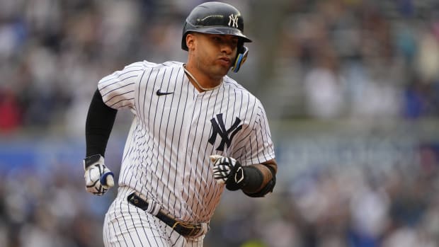 Yankees infielder Gleyber Torres rounds the bases after hitting a home run.